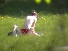 A creeper in the bushes catches a nude pair fucking in the park with his cam. Their nude bodies get it on and enjoy their sex without a care in the world or the slightest suspicion that someone may be lurking.